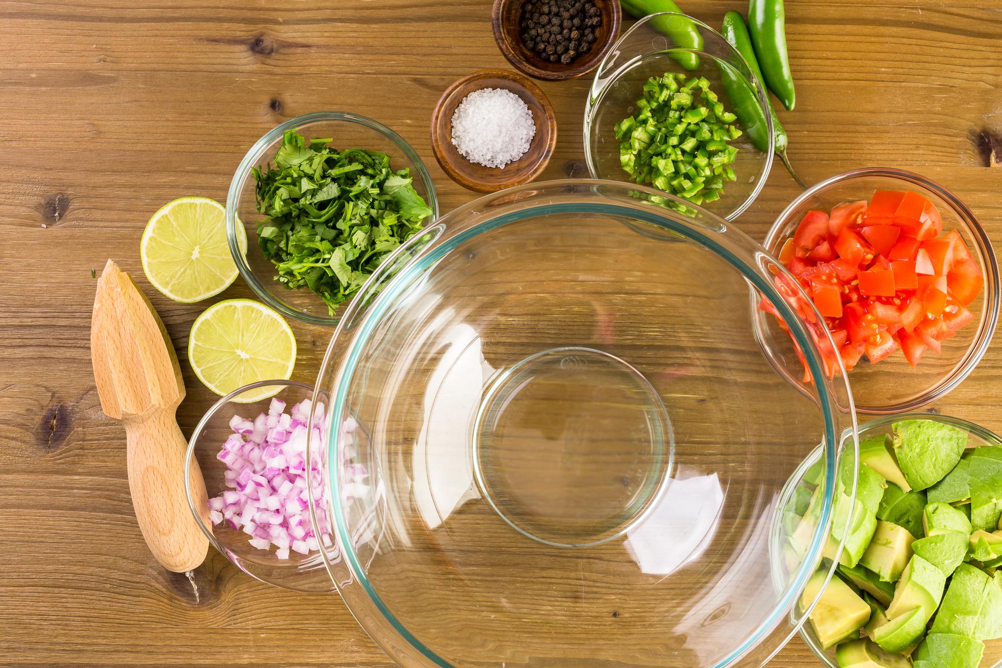 Stack of mise en place bowls with labeled ingredients